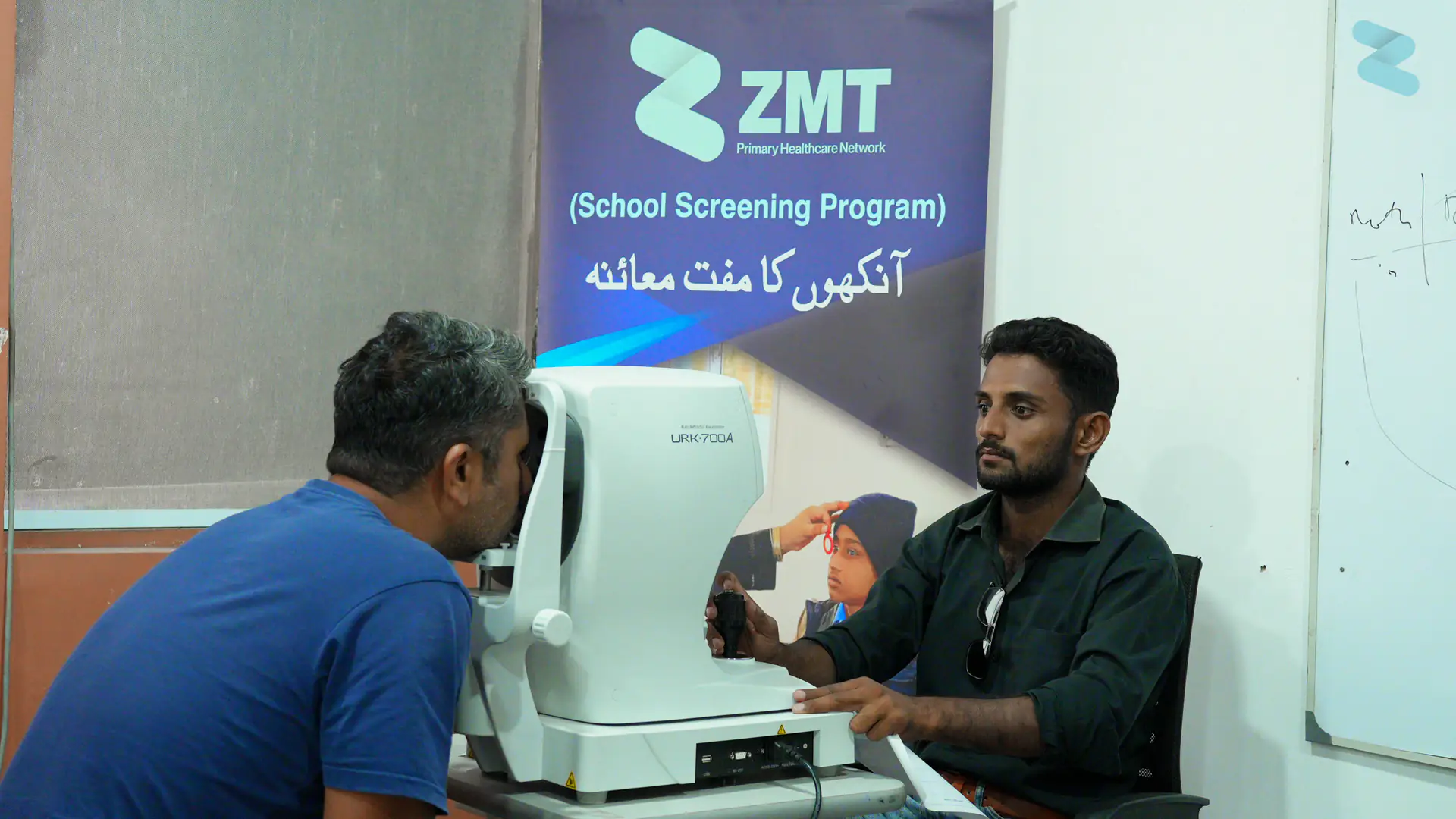 A patient having an eye scan at a ZMT school screening programme