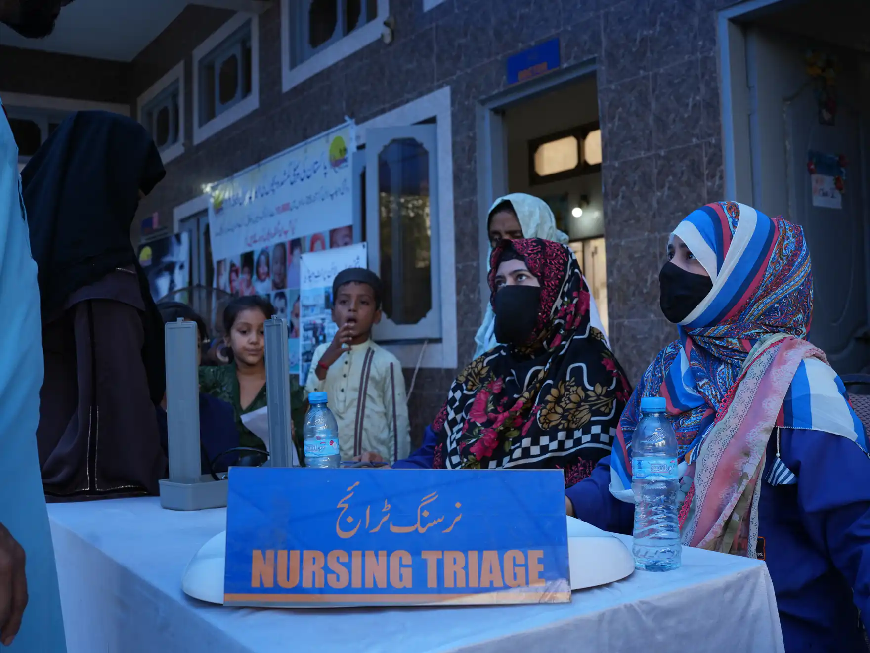 ZMT nurses at a nursing triage desk during a community health camp