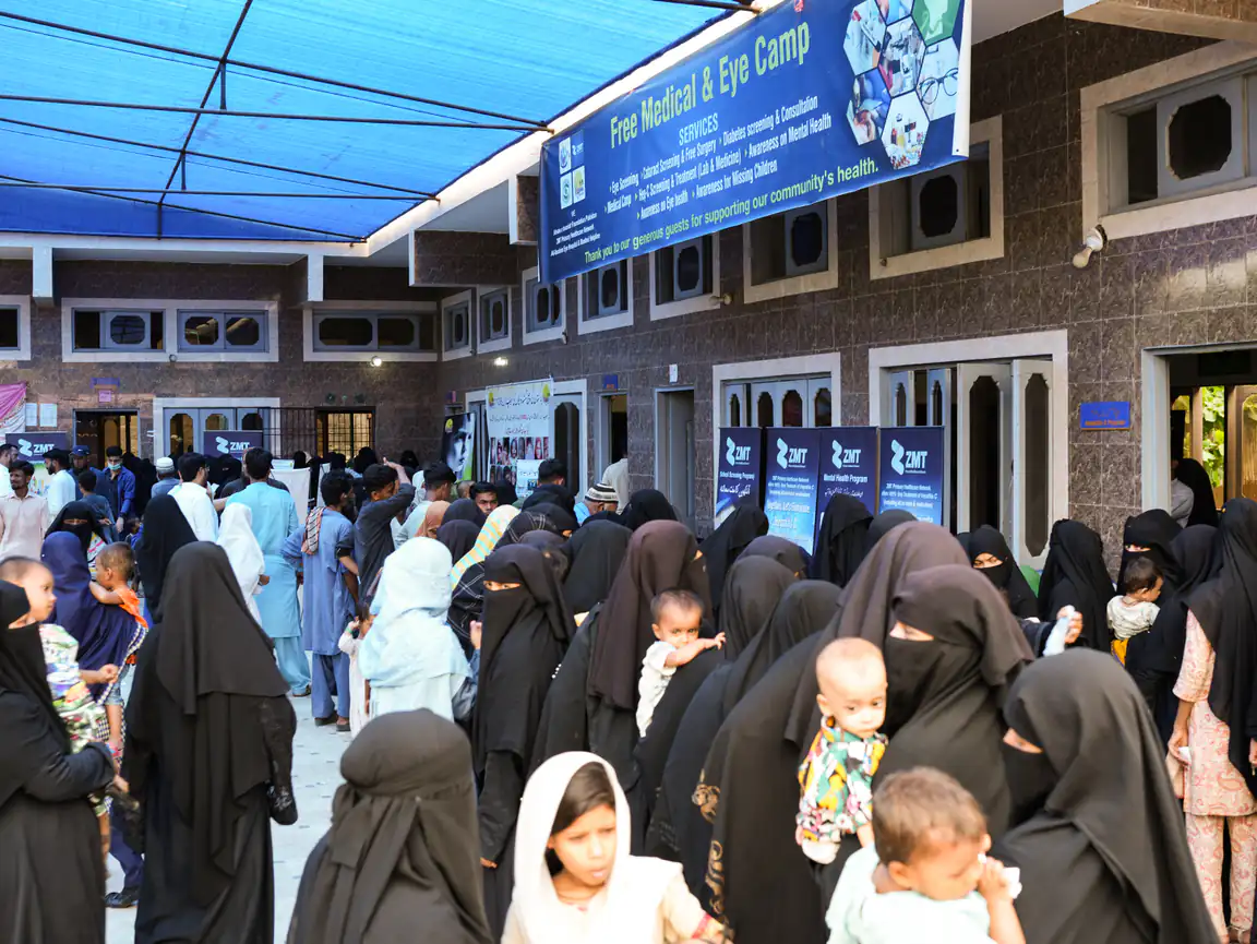 Families queueing at a ZMT free medical and eye camp in Karachi